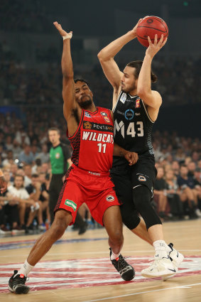 Perth's Bryce Cotton defends against United's Chris Goulding.