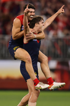 Petracca celebrates a goal with Luke Jackson.