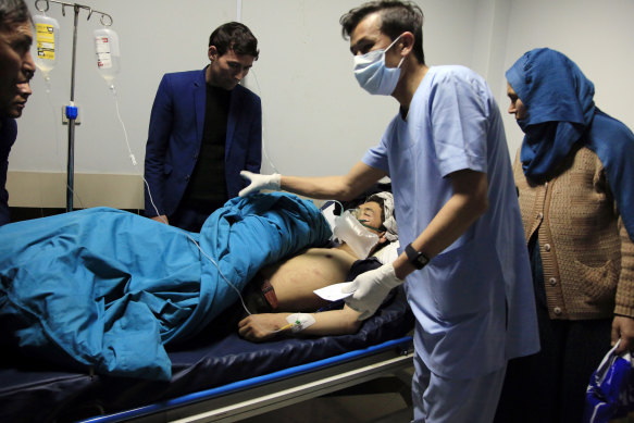 An Afghan receives treatment at hospital after suicide attack in Kabul, Afghanistan, Saturday, on October 24. The death toll from the suicide attack Saturday in Afghanistan's capital has risen that includes schoolchildren, the interior ministry said.