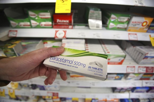 A customer inspects a box of Paracetamol tablets at a supermarket in Sydney.