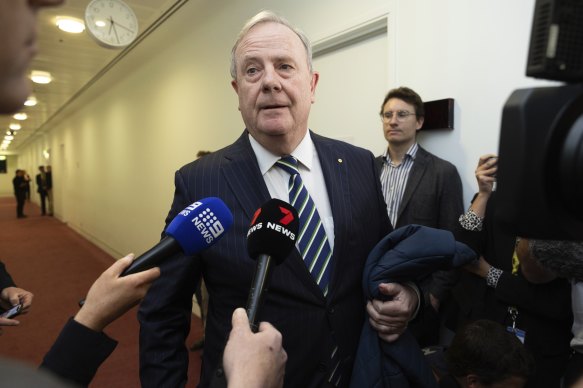 Peter Costello talking to journalists after the incident involving a reporter.