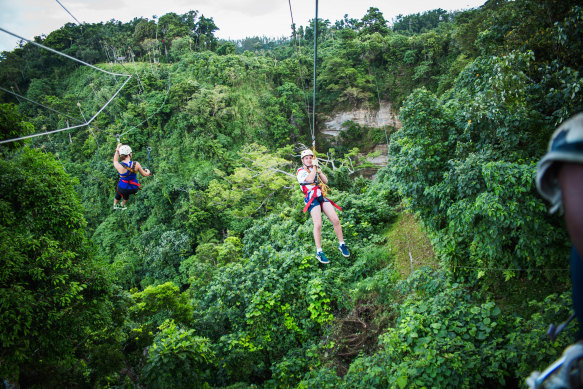 Tourists taking the plunge at Vanuatu Jungle Zipline.