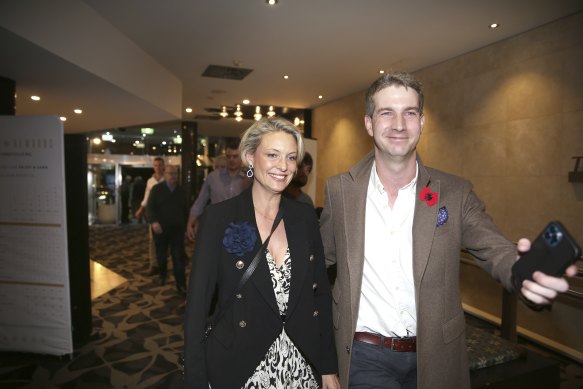 Katherine Deves is escorted into the Forestville RSL by adviser James Flynn for a campaign event.