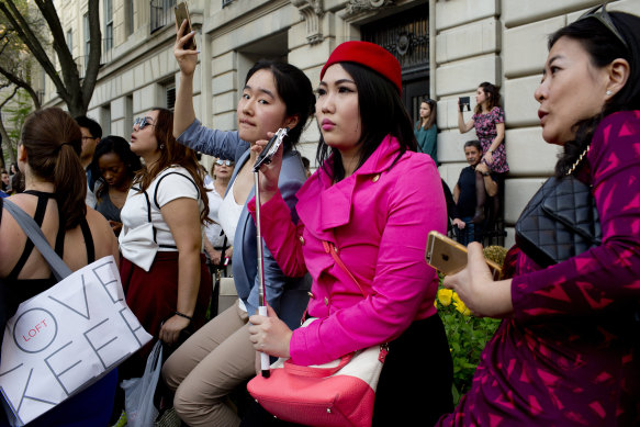 Fans gather on the pavement near the Met museum to catch a glimpse of the celebrity guests arriving at the gala.