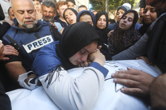 Al Jazeera journalist Wael Dahdouh (left) mourns his son Hamza.