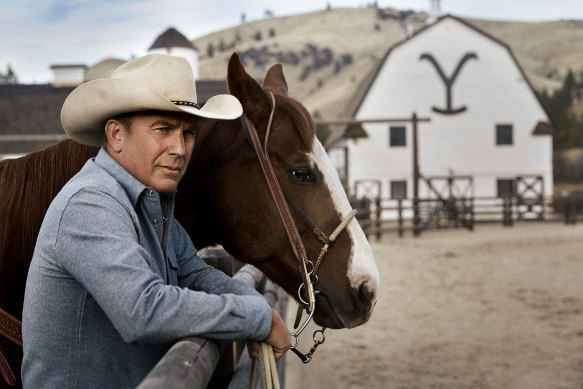 Yellowstone’s Dutton Ranch: a log cabin, mountain landscape, and Kevin Costner.