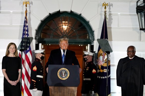 President Donald Trump speaks before Supreme Court Justice Clarence Thomas administers the Constitutional Oath to Amy Coney Barrett on the South Lawn of the White House. 