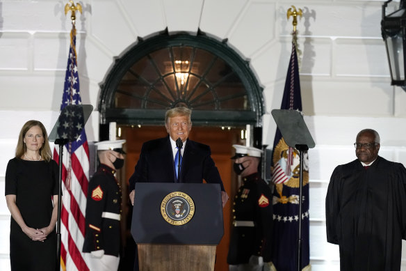 President Donald Trump speaks before Supreme Court Justice Clarence Thomas administers the Constitutional Oath to Amy Coney Barrett on the South Lawn of the White House. 