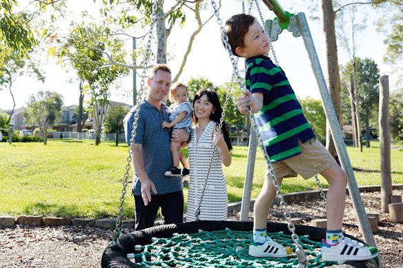 Adam Mather and Tiffany Tung with their baby, Taylen, now 14 months, and four-year-old, Tobie. Taylen contracted measles on a flight home from Bali before he was vaccinated. 