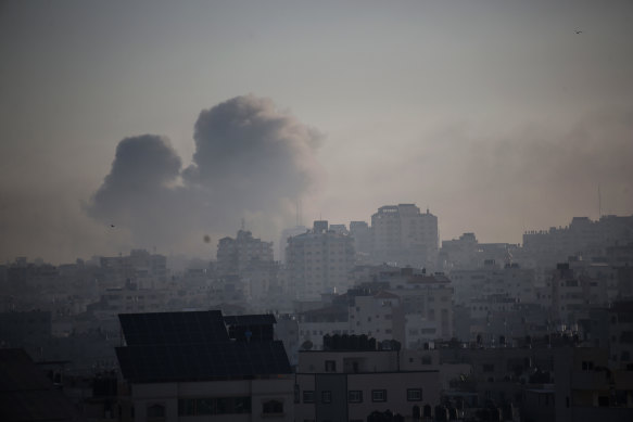 Smoke rises from Israeli raids on early Friday. 