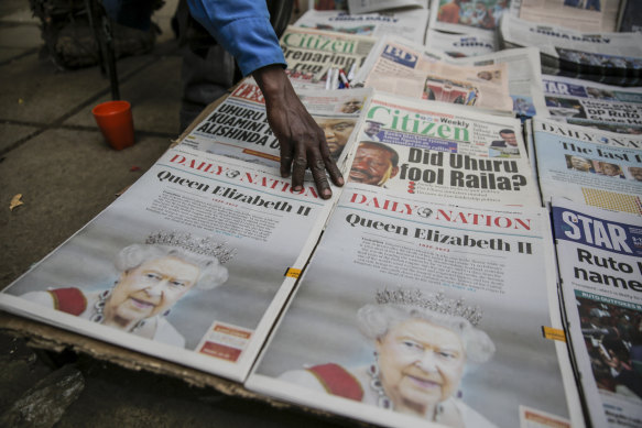 Kenyan newspapers show coverage of the death of Queen Elizabeth II at a stand in downtown Nairobi.