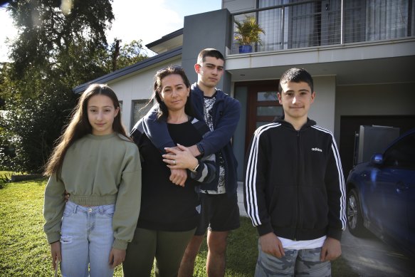 Katherine Maiorca and her children Imogen, Nicholas and Sammy in front of their family home in Sutherland which took 18 months to build.