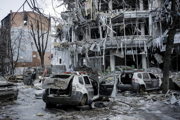 Damaged vehicles and buildings in Kharkiv city centre on Wednesday.