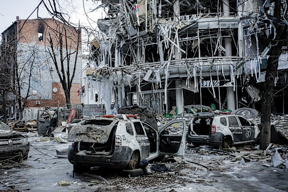 Damaged vehicles and buildings in Kharkiv city centre on Wednesday.