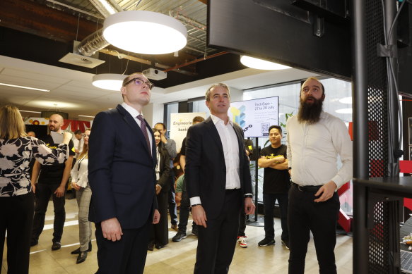 CBA chief executive Matt Comyn (centre) and chief information officer for technology Brendan Hopper (left) at the bank’s new Melbourne tech hub.