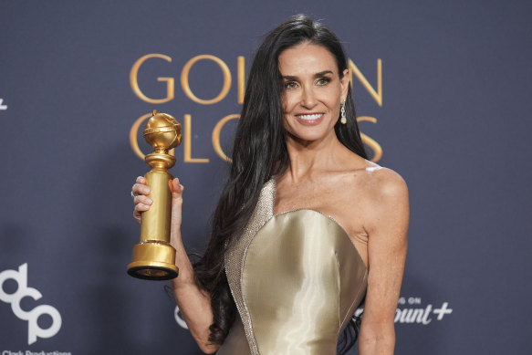 Demi Moore with the award for best performance by a female actor in a motion picture – musical or comedy for “The Substance”.