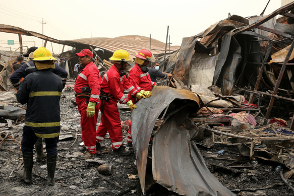 Workers search for bodies after a catastrophic blaze destroyed a COVID-19 ward at a hospital in Nassiriya, Iraq.