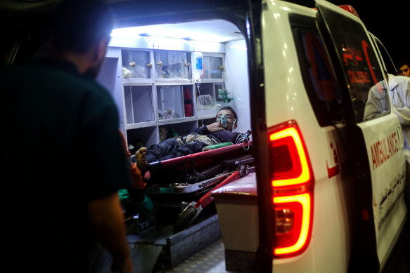 Palestinian injured in Israeli air strike arrive at Nasser Hospital in Gaza.