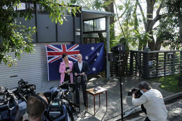 Former Queensland premier Campbell Newman announces his return to politics from the driveway of his Brisbane home with wife Lisa.