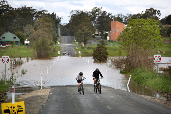 Floodwater cuts off Wolseley Road, in McGraths Hill in Sydney’s west, on Sunday after heavy rain battered NSW at the weekend.