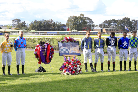 Jockeys pause for a minute’s silence in honour of the passing of Her Majesty Queen Elizabeth II, during Sydney racing at Rosehill Gardens on Saturday.