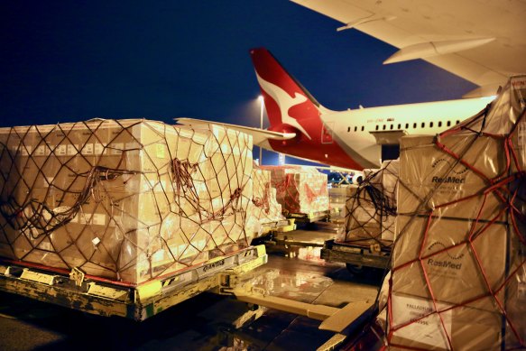 COVID-19 supplies for India being loaded into a Qantas plane on Wednesday.