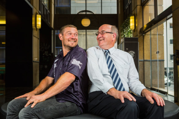 Simon Hughes and his father David Hughes posing for a photo in 2015.