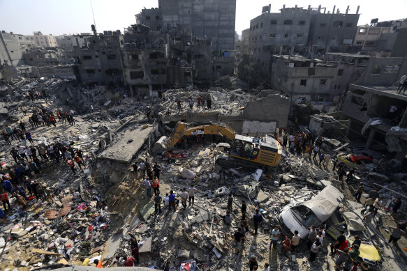 Palestinians look for survivors under the rubble of destroyed buildings following the first Israeli airstrikes on the Jabalia refugee camp, northern Gaza Strip thsi week.