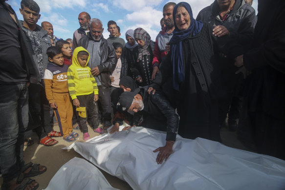 Palestinians in Khan Younis mourn the deaths of relatives killed in the Israeli bombardment of the Gaza Strip.