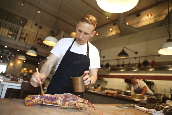 Chef Ben Greeno prepares a rock lobster for the rotisserie at The Paddington. 