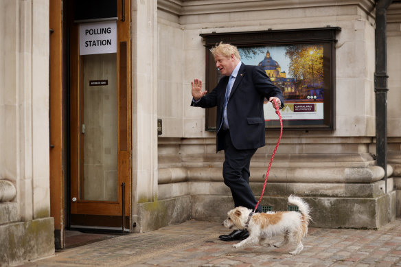 British Prime Minister and Conservative Party leader Boris Johnson arrives to cast his vote at a polling station in London.