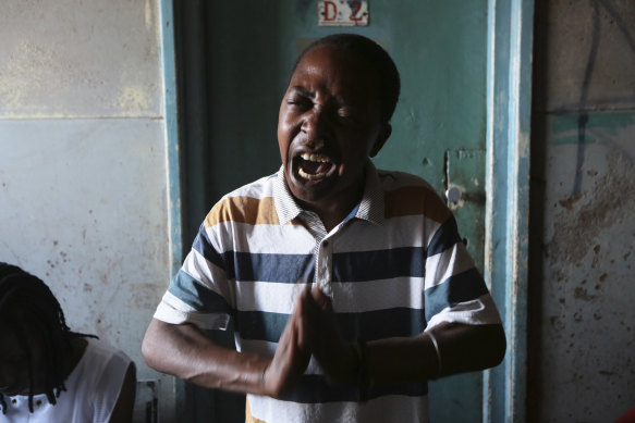 A drug user desperate for recovery is seen praying while attending a support group session at a block of flats in Mbare, Harare.