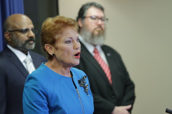 One Nation leader Pauline Hanson with fellow candidates George Christensen (right) and Raj Guruswamy, who were unsuccessful.
