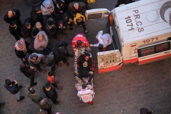 Palestinians injured in an Israeli airstrike arrive at Nasser Medical Hospital in Khan Younis.