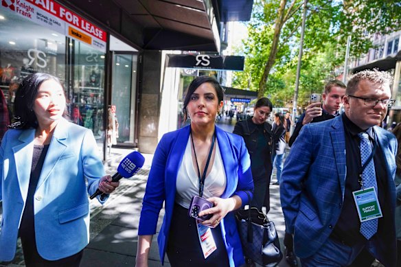 Liberal MP Moira Deeming (centre) leaving Liberal Party headquarters on Sunday after losing the preselection to Dinesh Gourisetty.