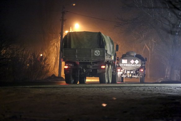 Military trucks move down a street outside Donetsk, the territory controlled by pro-Russian militant.