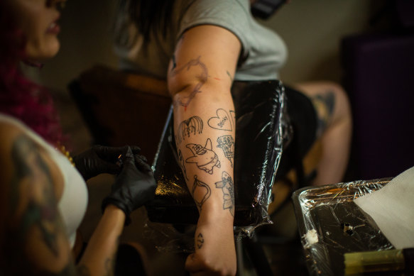 Visible tattoos are no longer considered an impediment to getting a job.