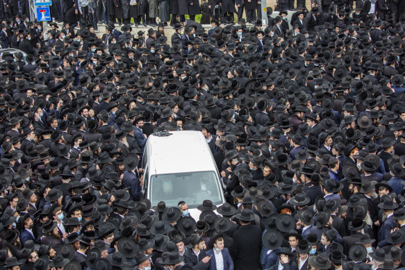 Thousands of ultra-Orthodox Jews participate in the funeral for prominent rabbi Meshulam Soloveitchik, in Jerusalem despite the country’s ban on large public gatherings due to COVID-19. 