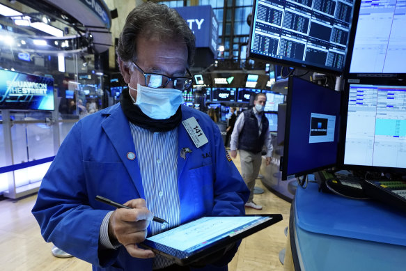 Wall Street rallied late to avoid another day of losses for its benchmark index.