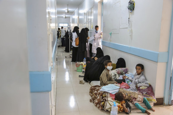 Patients suffering from suspected cholera wait to receive treatment at a hospital in Yemen's capital, Sanaa.