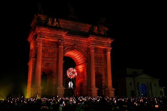 Torchbearers Deborah Compagnoni and Alberto Tomba lights the Olympic cauldron at the Arco della Pace during the opening ceremony.