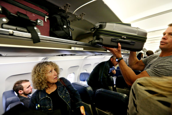 The battle over overhead bin space on planes is getting ridiculous, as more and more passengers try to travel with hand-luggage only.