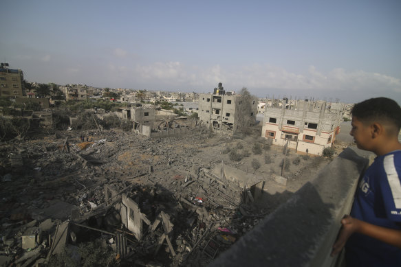 A boy surveys destruction caused by Israeli bombardment of the Gaza Strip.