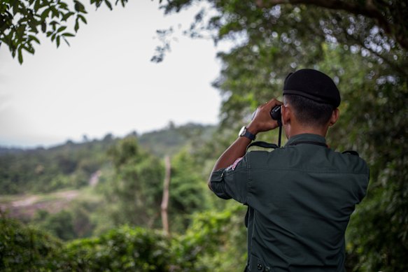 Cambodian corporal Dy Song Heth keeps watch on Thailand from the Preah Vihear temple.