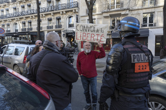 Members of a “Freedom Convoy” block a road leading to the Arc de Triomphe in Paris, France.  Numerous convoys have been headed toward the French capital since Wednesday. 