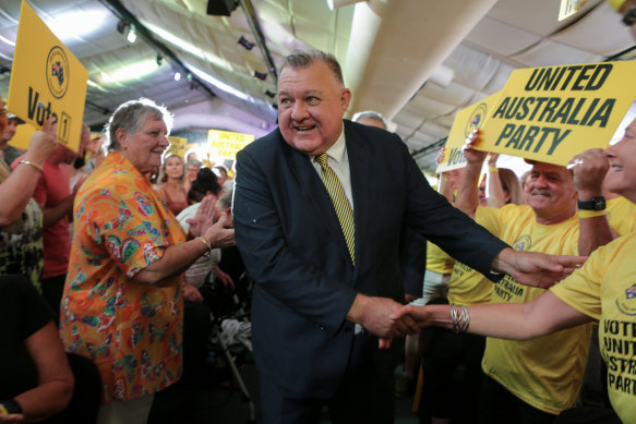 United Australia Party leader Craig Kelly is met by enthusiastic supporters at Saturday’s campaign launch. 