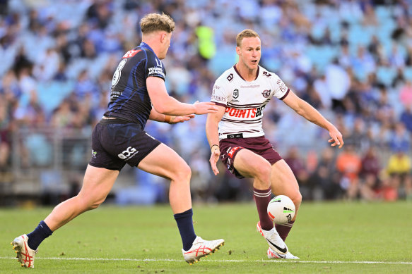 Daly Cherry-Evans takes a kick in a game against the Bulldogs last year.