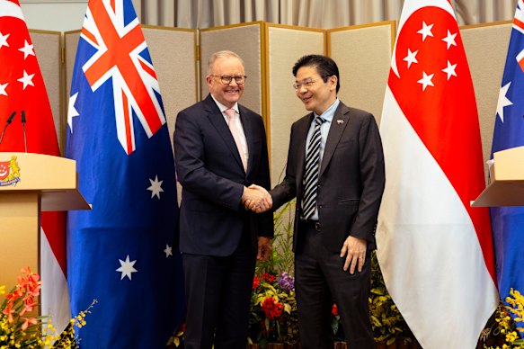 Shake on it … Australian Prime Minister Anthony Albanese with his Singaporean counterpart Lawrence Wong. 