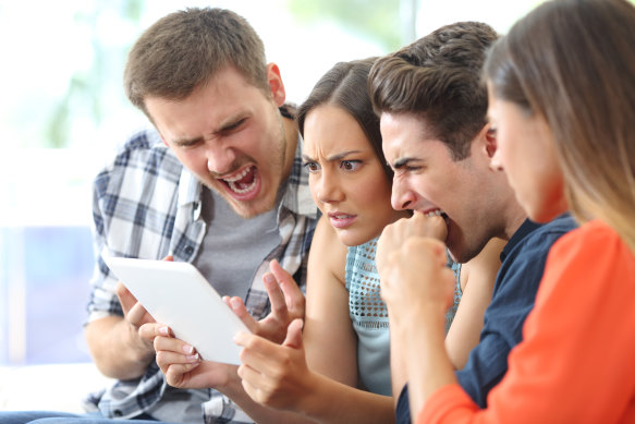 Stock photo of my neighbours and me reading the email from our strata management company.