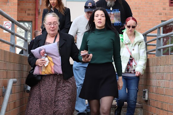 Georgie Burt (centre), the mother of Zane Mellor, with supporters outside Devonport Magistrates Court on Friday.